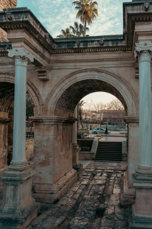 the courtyard of a building with a few archways