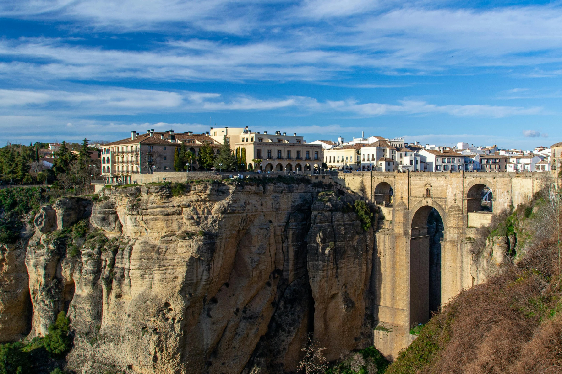 the building on the cliff has been built into the rock