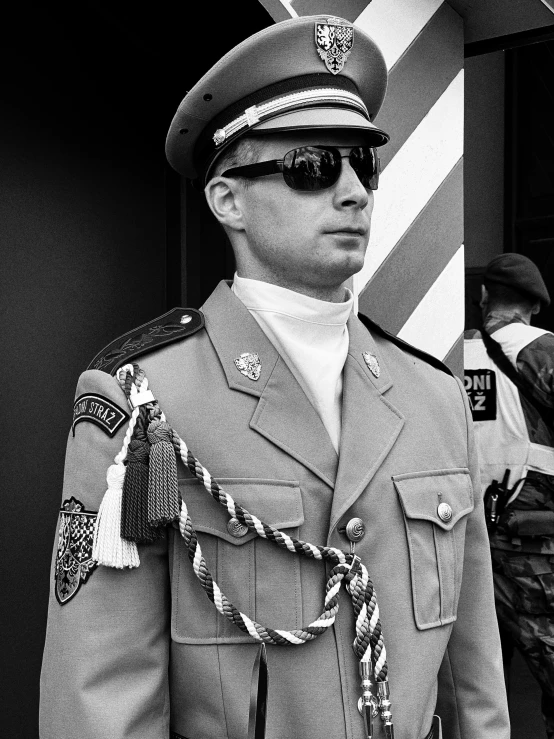 a man in a uniform in front of a fire station