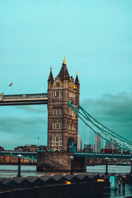 a blue sky hangs above a view of the tower bridge and city