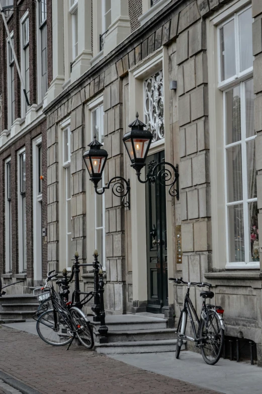 bicycles parked on the sidewalk of an old town