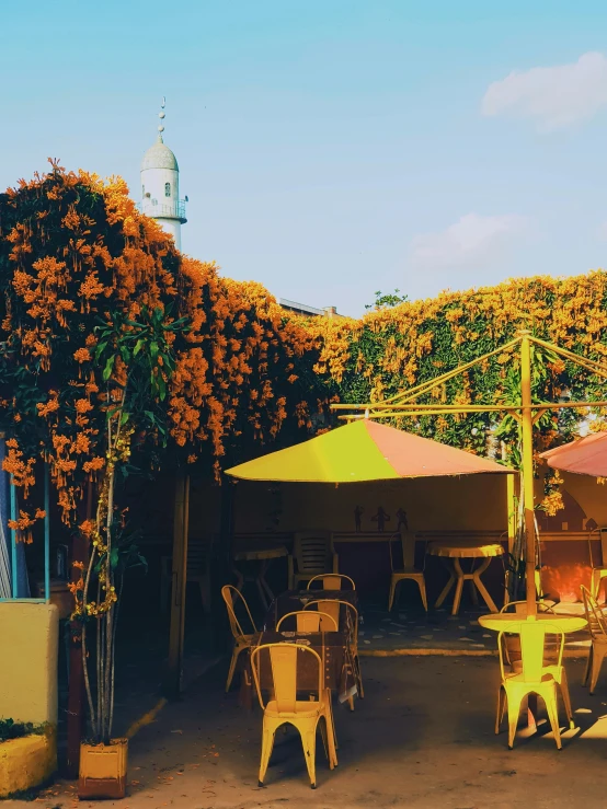 tables and chairs outside on a sunny day