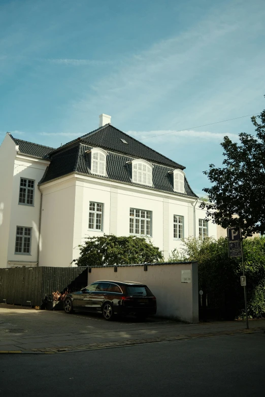 a large white house on a street corner