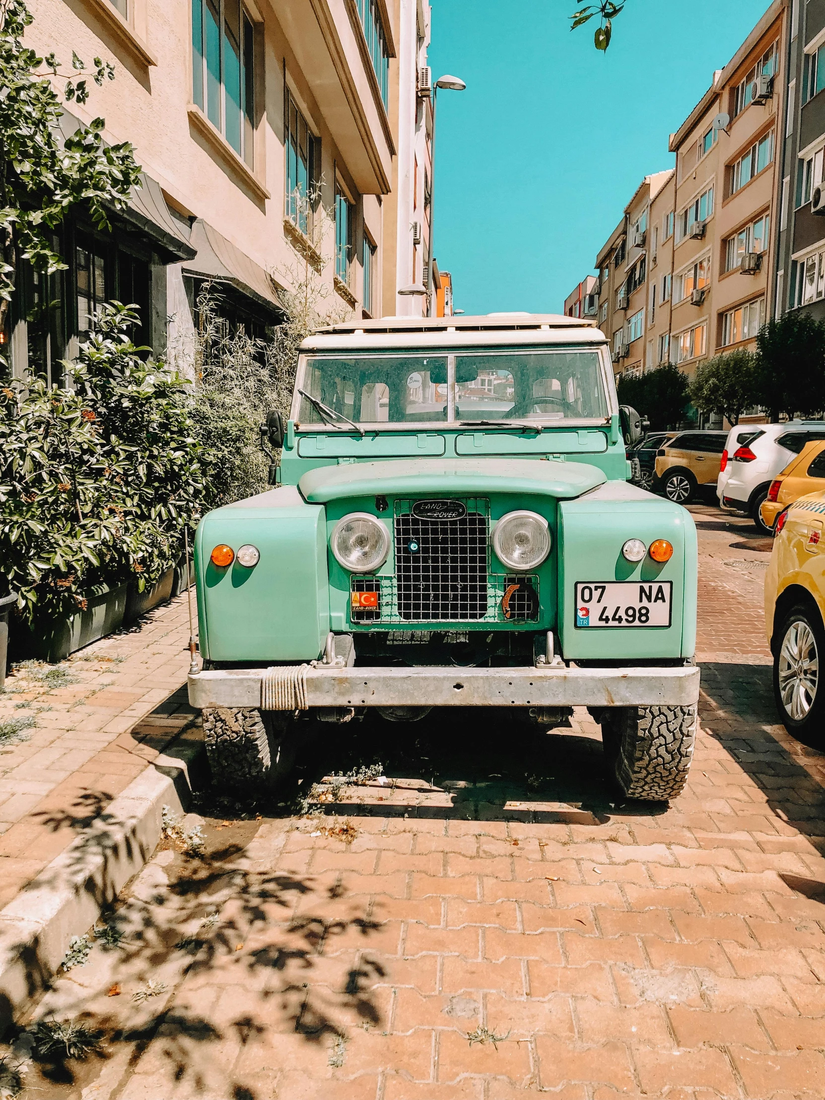 there is an old truck parked in the street