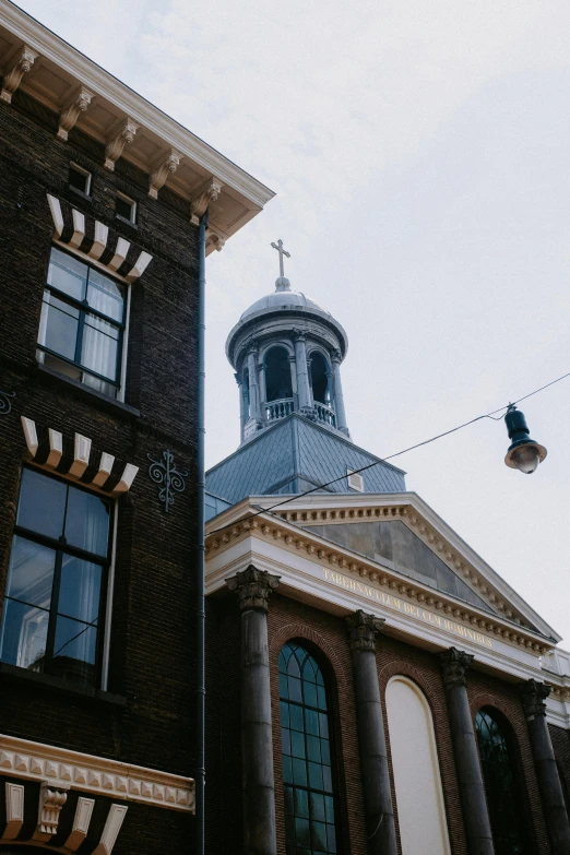 a building with a tower near the top of the building