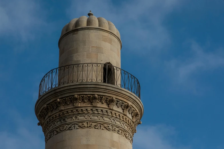 a very tall tower with a bird on the top of it