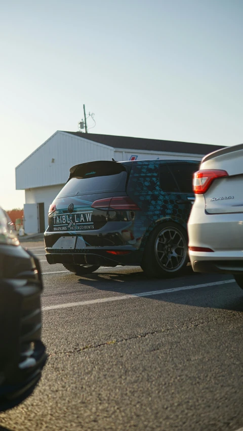 a car with a lot of exhaust and front bumper stickers on it