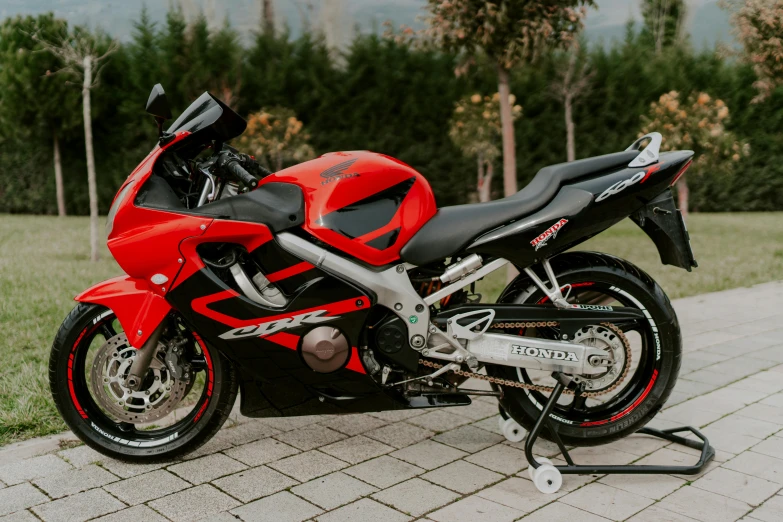 a motorcycle parked in a driveway with an extended motorcycle seat