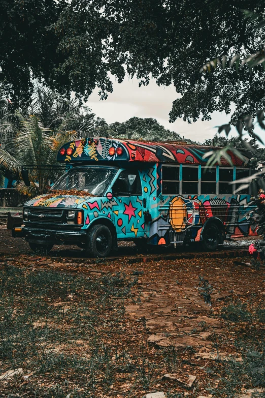 a colorful bus is painted with many designs