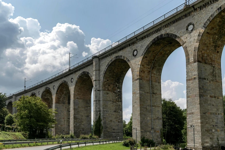 several arches of the old bridge on which there are statues