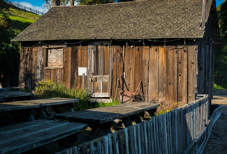 an old building has some wood on it