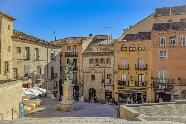 the view of a city street that has old buildings