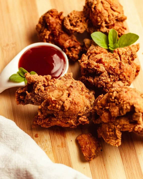 a plate of chicken sticks sitting on top of a  board