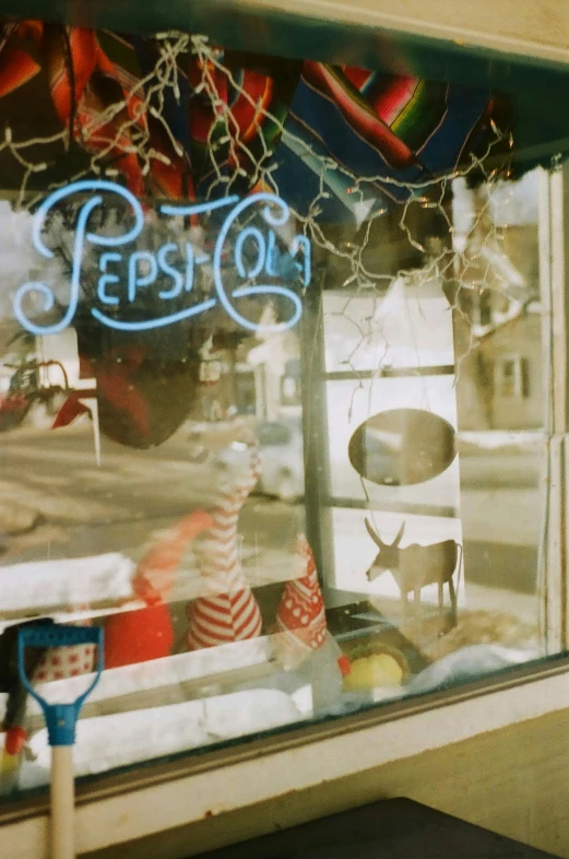 an empty store window is showing some decorations