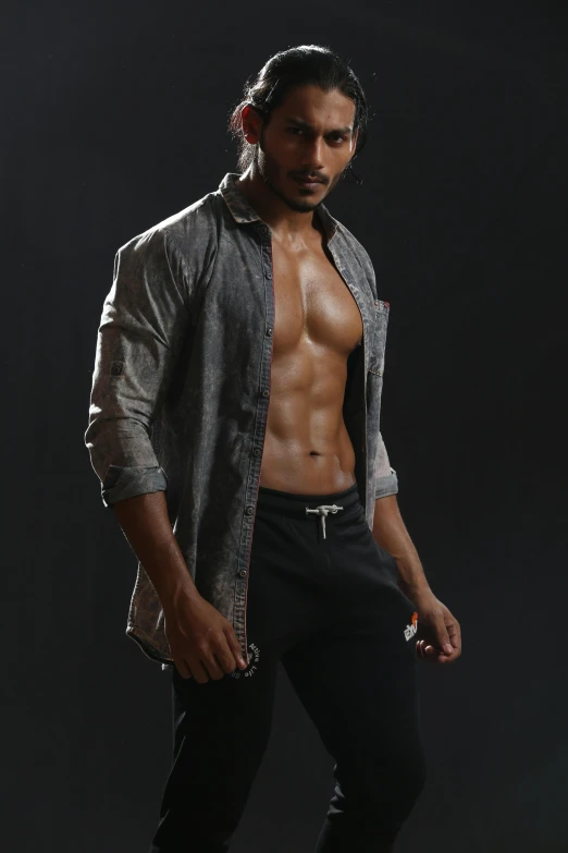 a shirtless male posing for a picture