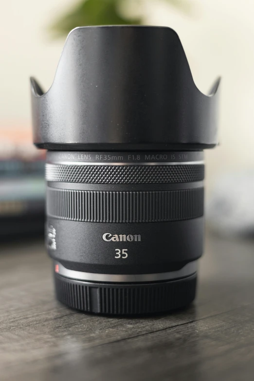 a lens sits on top of a wooden table