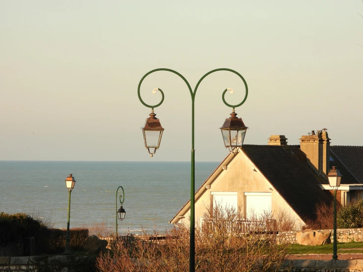 a light pole sitting next to a sea view