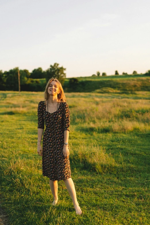 woman standing in the middle of a field