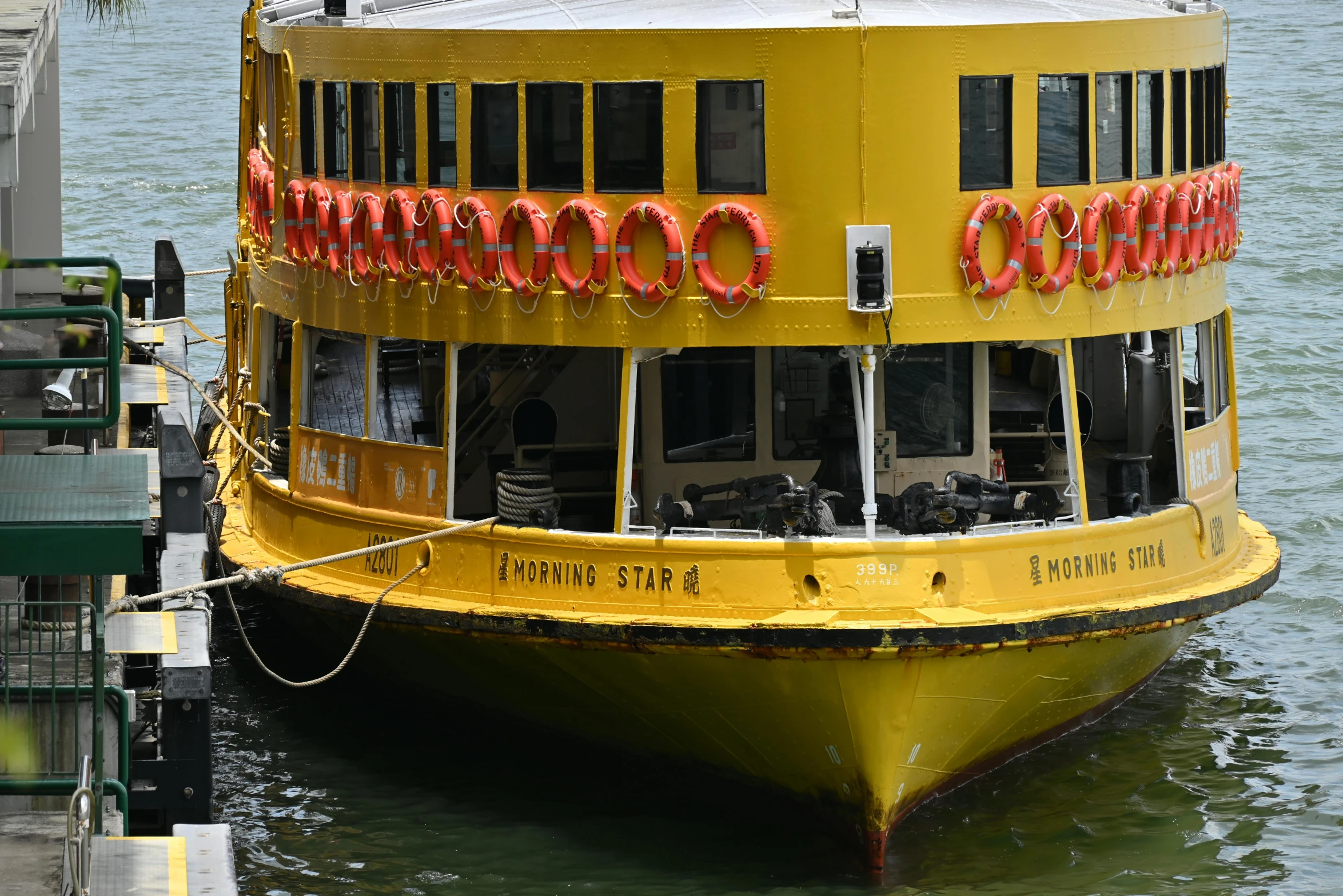 a yellow boat is docked in the water