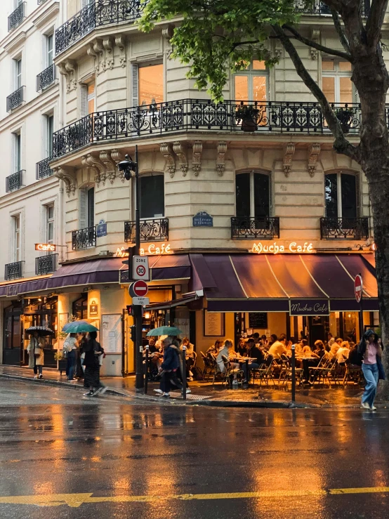 a building with a street corner in the rain