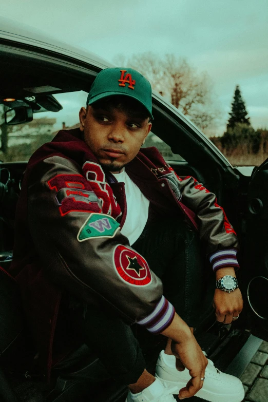 a young person is sitting in the backseat of a car