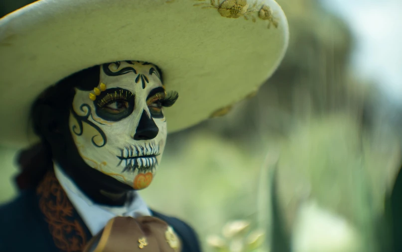 a woman with a skeleton painted on her face