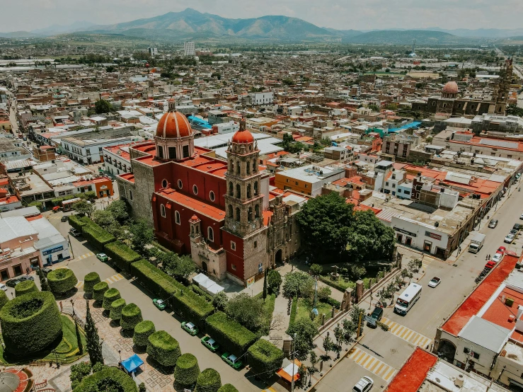 an old church rises above a large town