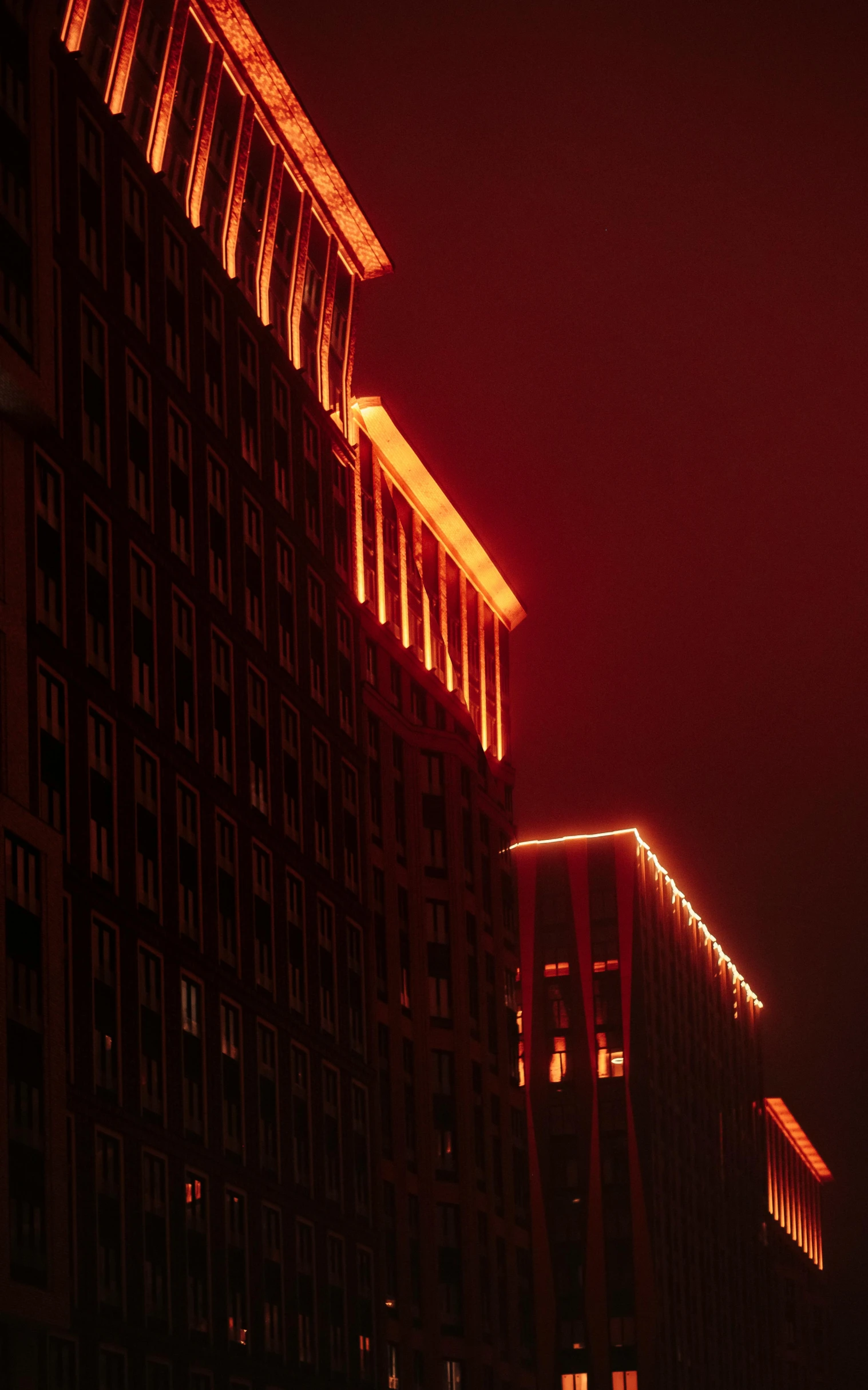 a red and black s of buildings with lights on them