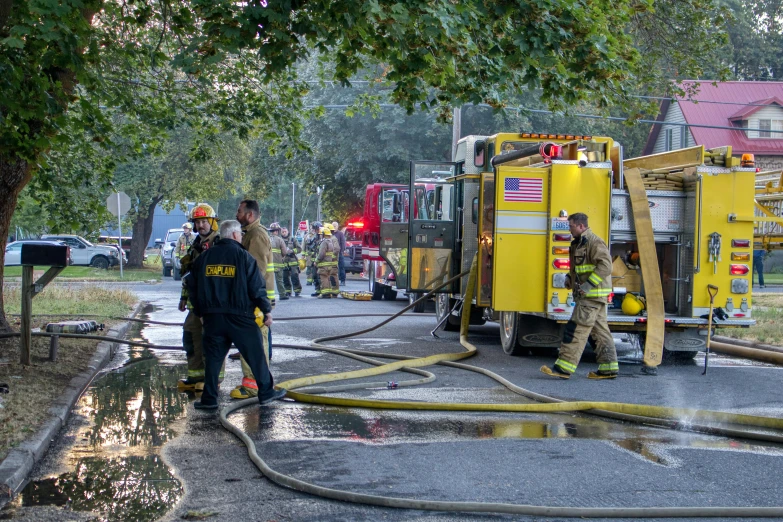 firefighters are trying to extinguis fire that is in the road