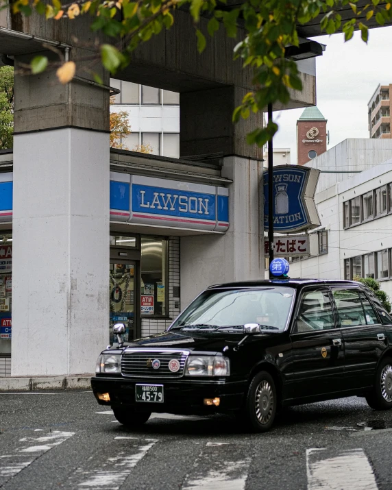 an suv drives down the street in front of lawton's