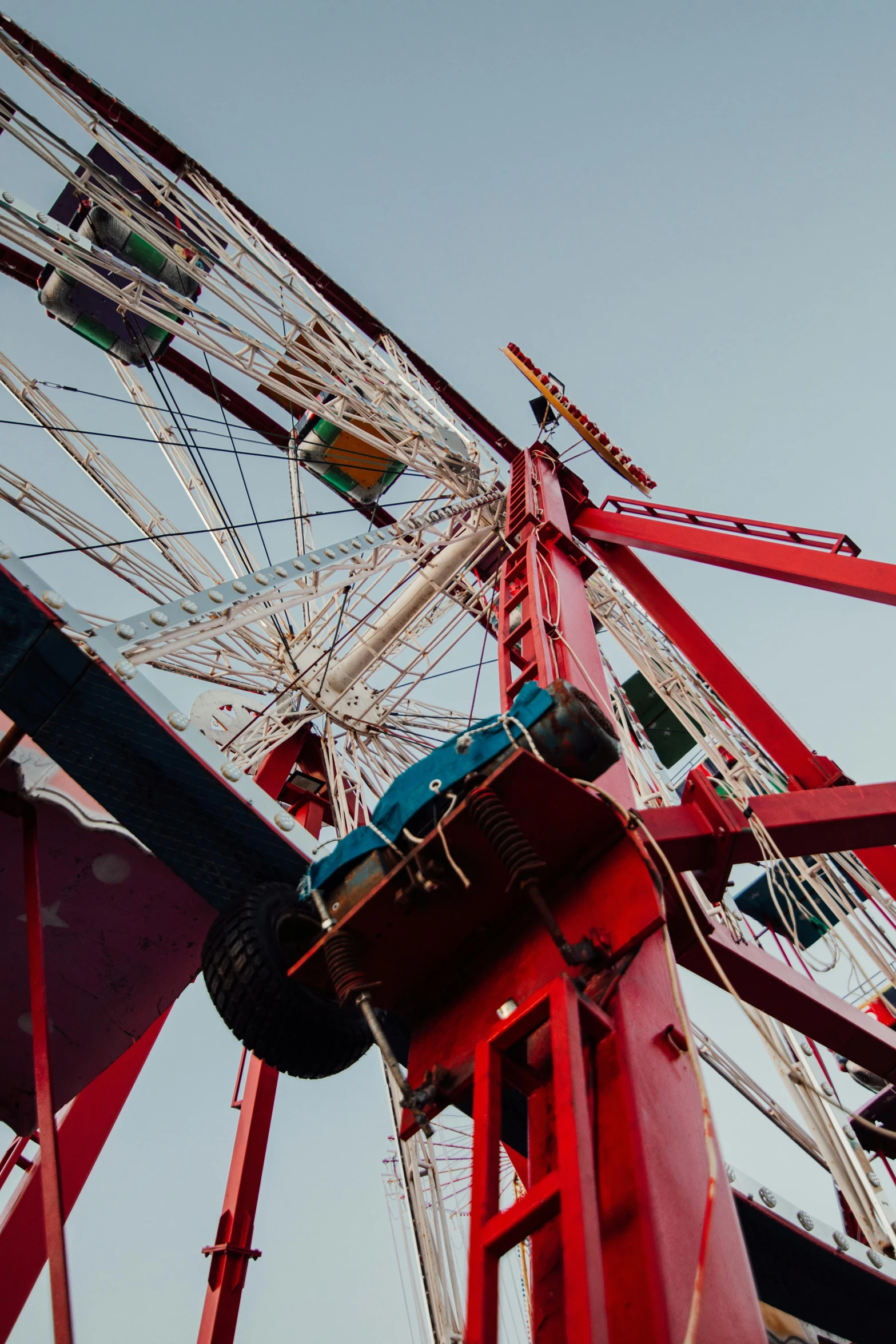 a big ferris wheel against the sky and in the background