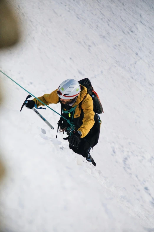 a man skiing down the mountain with snow on his hands