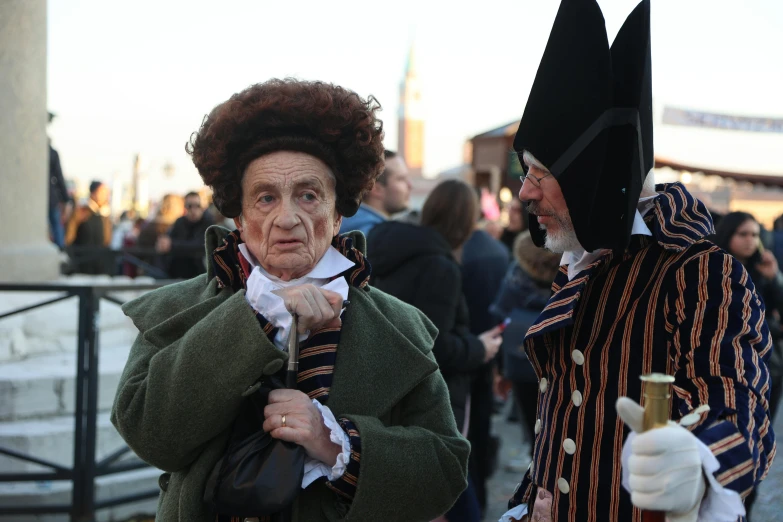 two older women in costumes walking together