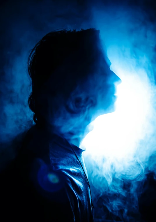 the man is shown with blue light coming out