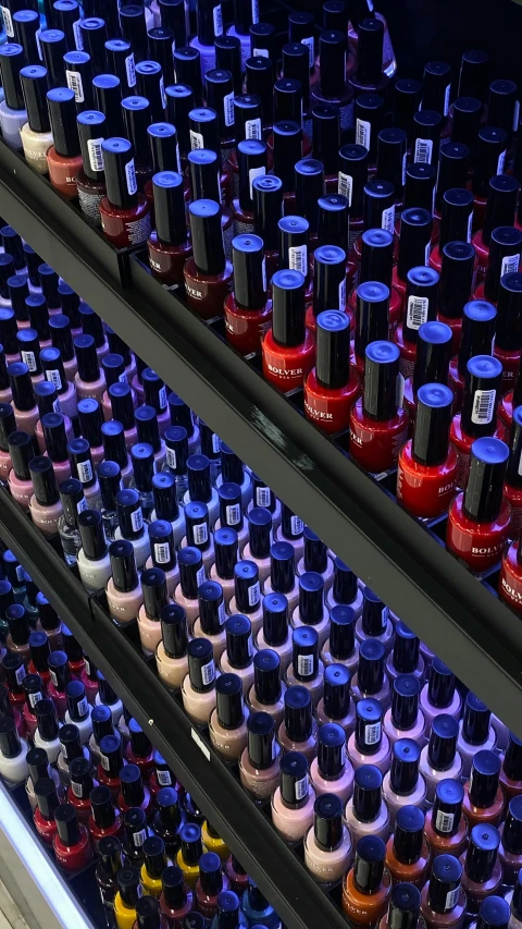 an assortment of different colors and sizes of nail polish