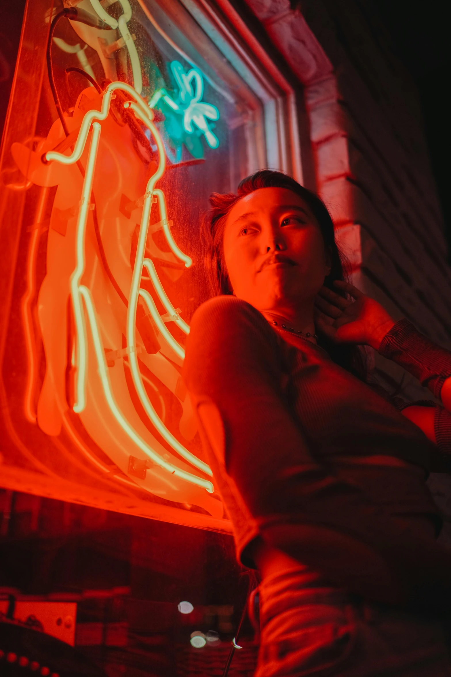 girl in a dark room with neon lights