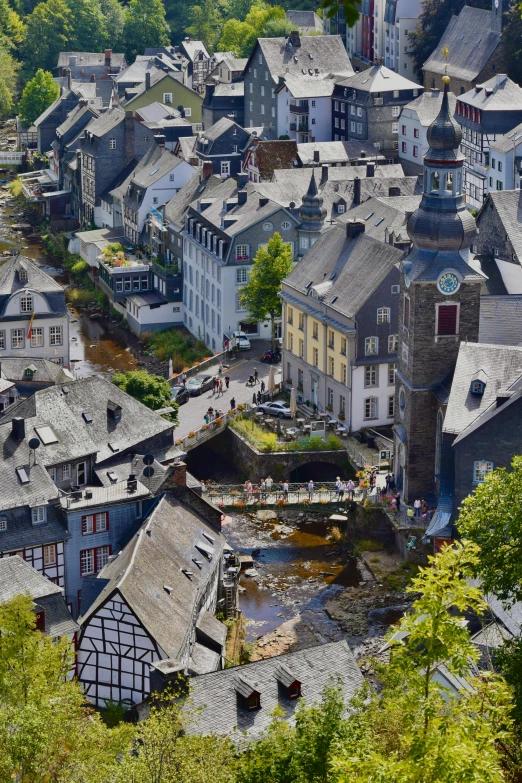 the aerial view of many different buildings on a hill