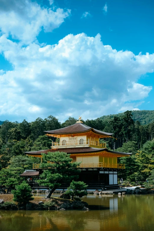 a small building is standing on top of some water