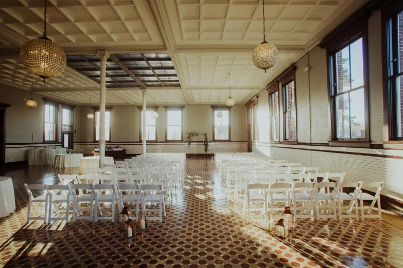 an empty ballroom, with rows of chairs