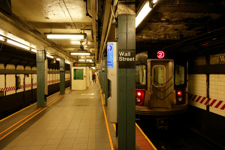 a subway station that has a long train in it