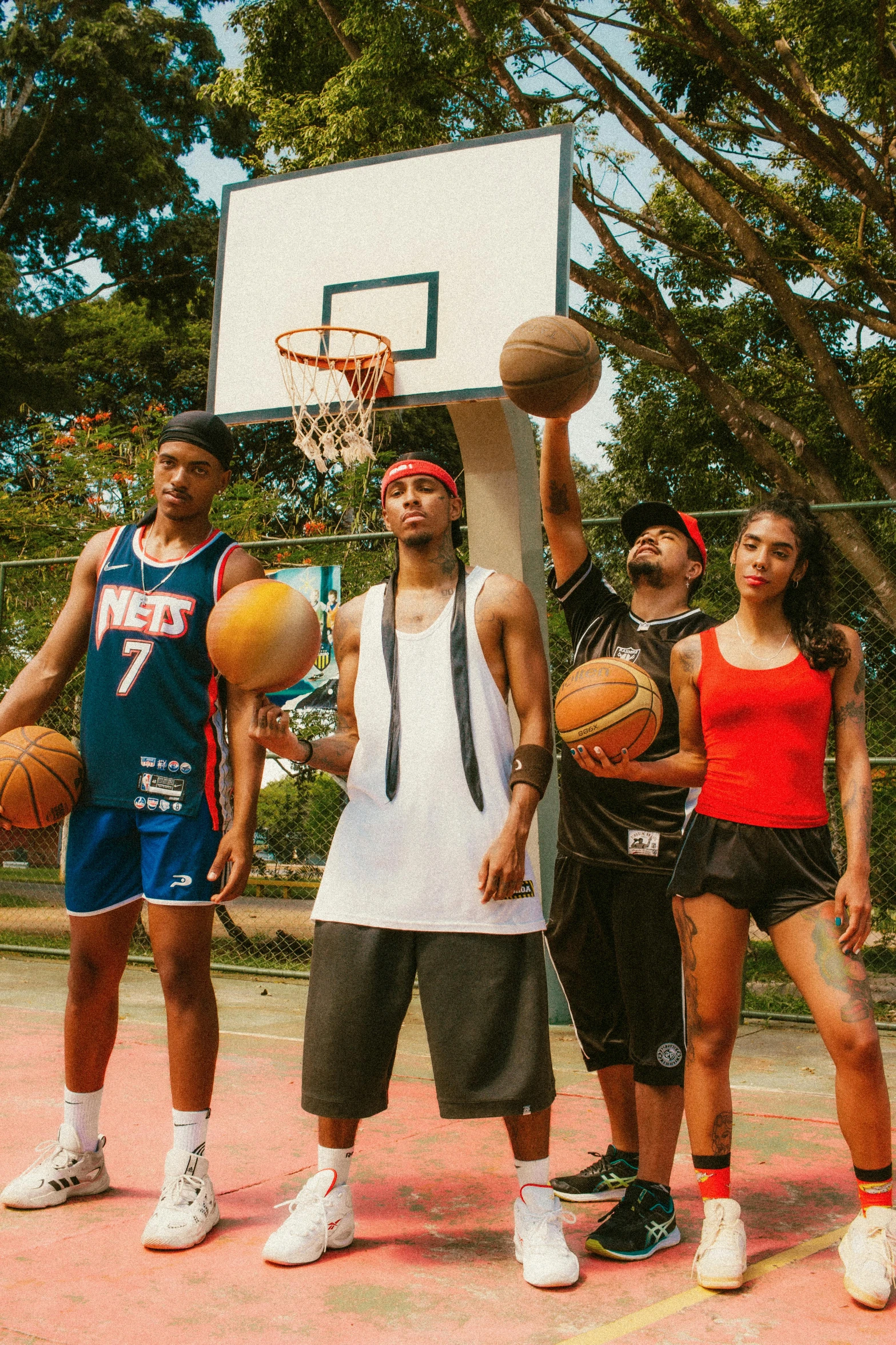 several basketball players and one is jumping for the ball