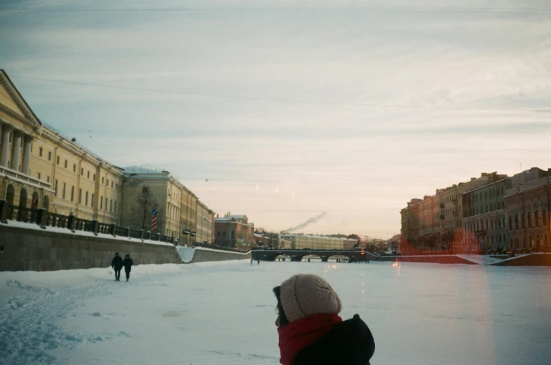 a person standing in the snow looking at soing