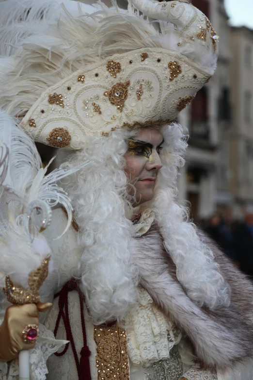 a man wearing a costume made of white feathers