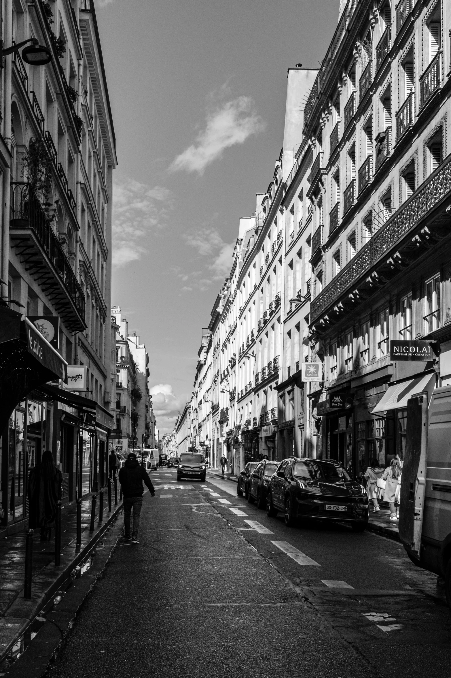 a black and white po of buildings in a street