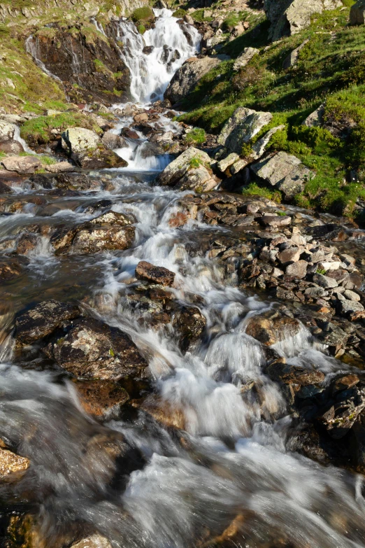 many small water features moving along a rocky hill