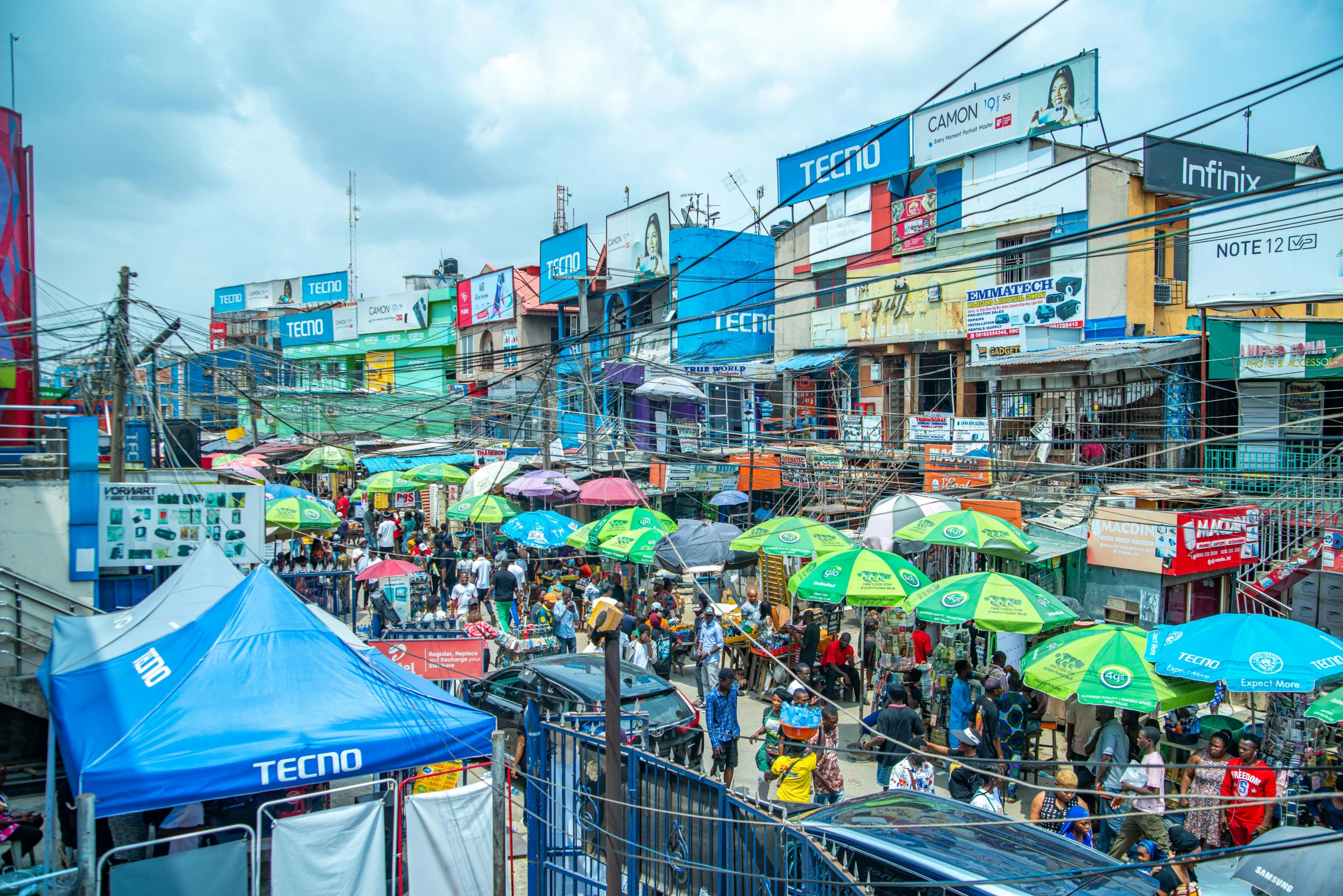 an outside city with people holding umbrellas