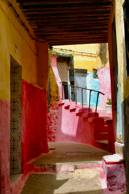 the stairs are covered in colorful paint and have railings between them