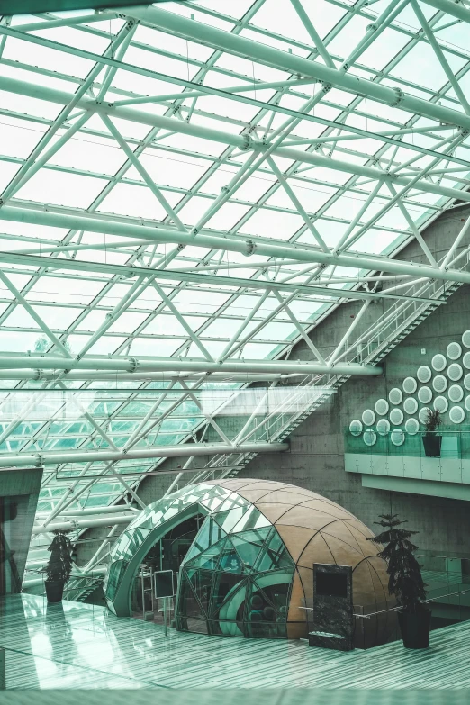 a walkway at a train station with multiple seating areas