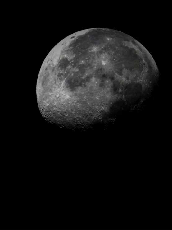 a full moon with dark background in the sky