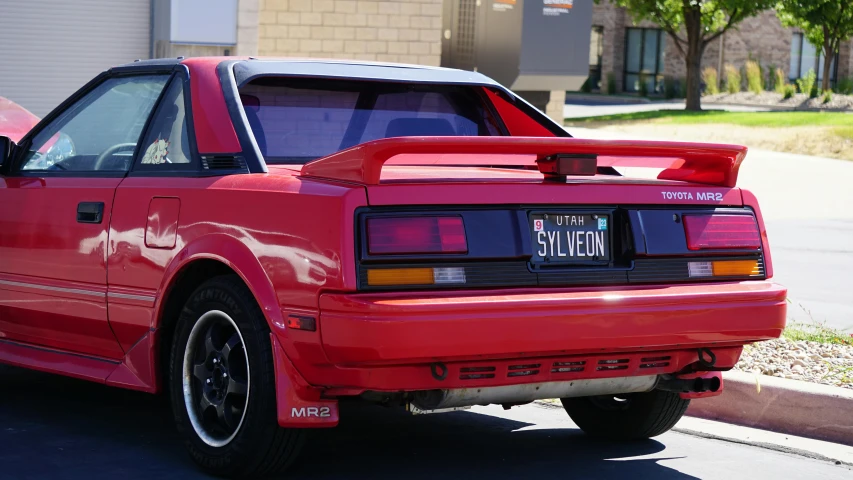 a red car with a tail fin